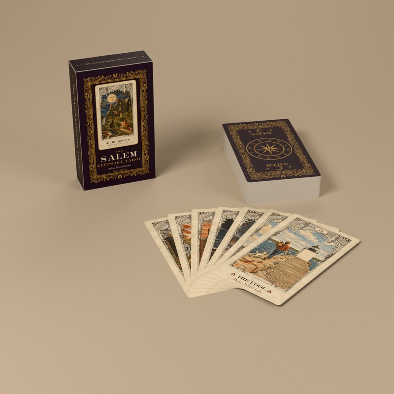 The tuck box, the deck face down, and seven cards fanned with The Fool on top